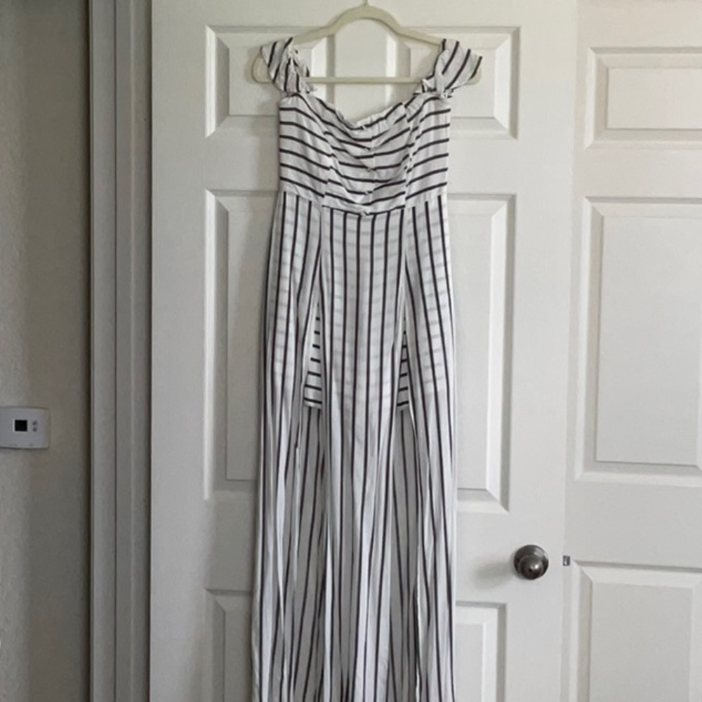 Women’s long drape dress. Black and white striped. Fits small.